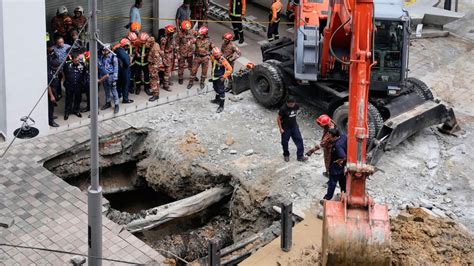 girlswalloed|Woman disappears down sinkhole in Malaysia's capital.